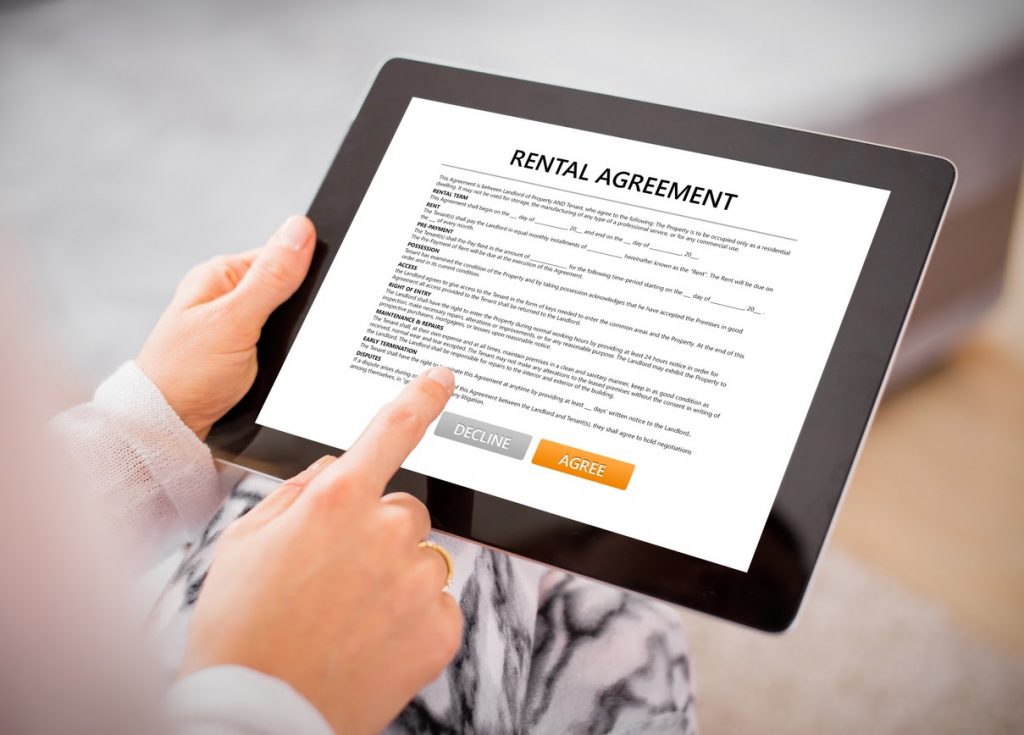 Reviewing a rental agreement before signing to know what First and Last Months' Rent is