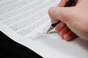 Person signing hold harmless agreement