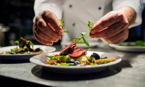 A chef prepares a gourmet meal at one of the many excellent Hyattsville restaurants.