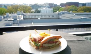 A chicken sandwich plate sits on an outdoor table overlooking the nation’s capital, just one of many options for brunch in D.C.