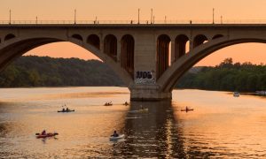 people kayaking in Northern Virginia in the Potomac River at sunset
