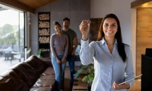 A landlord using QuickBooks online for rental properties while showing a home