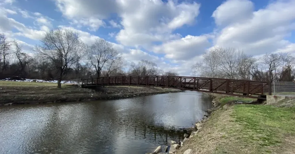 Scenic view of the Anacostia Tributary Trail System in Hyattsville, MD, featuring lush greenery and a winding path.