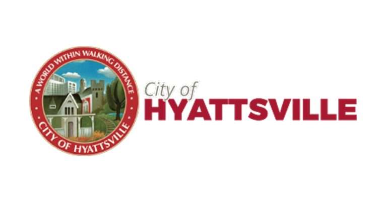 The official logo of the City of Hyattsville featuring a circular emblem with a scenic illustration of a house, trees, and buildings, with the words "A World Within Walking Distance" and "City of Hyattsville" around the border. To the right, the text "City of Hyattsville" is written, with "Hyattsville" in bold red font.