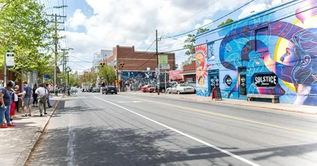 Brightly colored buildings and murals in the Hyattsville Arts District, showcasing local culture and creativity.