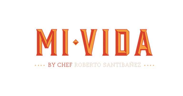 The logo of Mi Vida, a Mexican restaurant by Chef Roberto Santibañez, featuring bold, orange-red lettering with a gold accent on a white background.