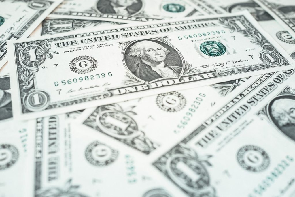 Dollar bills laid down, moving to alexandria