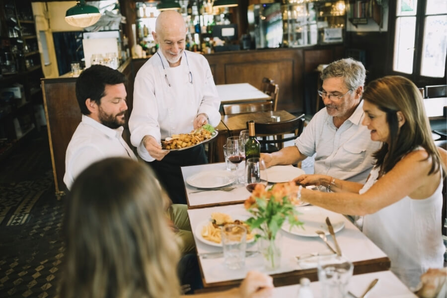 a family eating out together at a restaurant in Alexandria, VA
