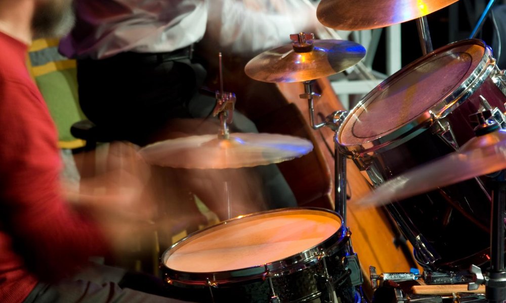 Guy playing drums for live jazz music