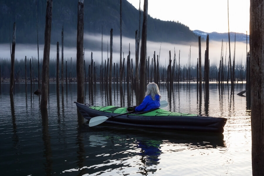 a person enjoying the scenery while kayaking at Lake Accotink 