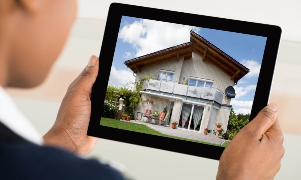 Person doing real estate speculation on tablet