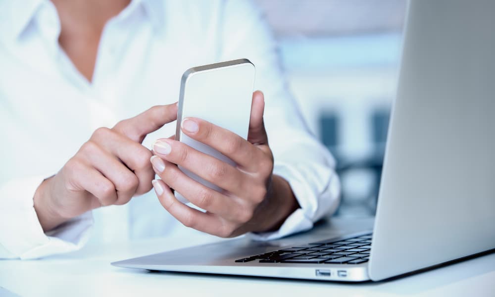 The Pros and Cons of Allowing Tenants to Use Venmo For Rent 1 making a payment on your phone