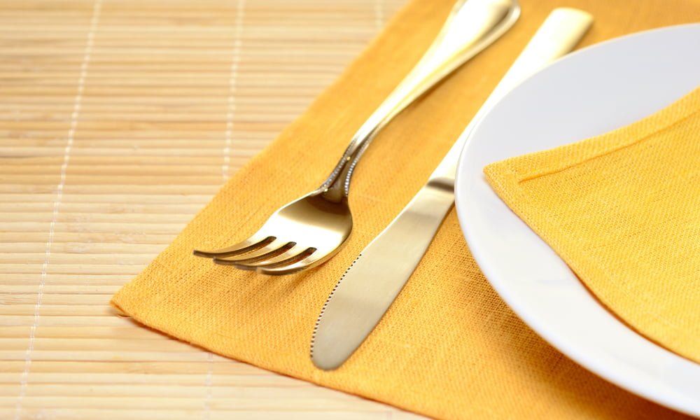 plate on yellow plate mat