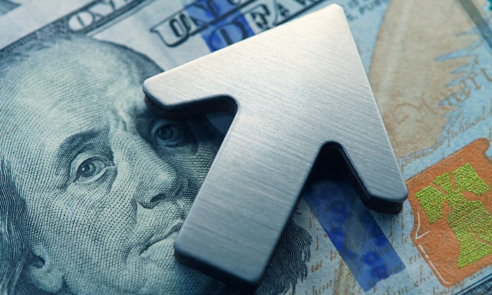 a picture of money and an arrow pointing up depicting the effects of inflation