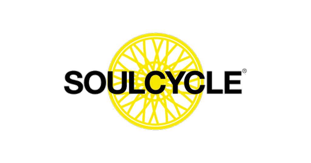 Bold "SOULCYCLE" text over a stylized yellow bicycle wheel design.